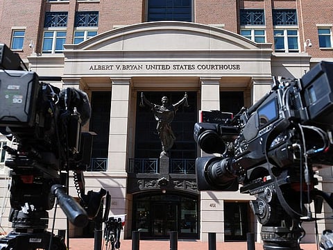 Members of the media await the sentencing of El Shafee Elsheikh outside the Albert V. Bryan Federal Courthouse in Alexandria, Virginia on August 19, 2022