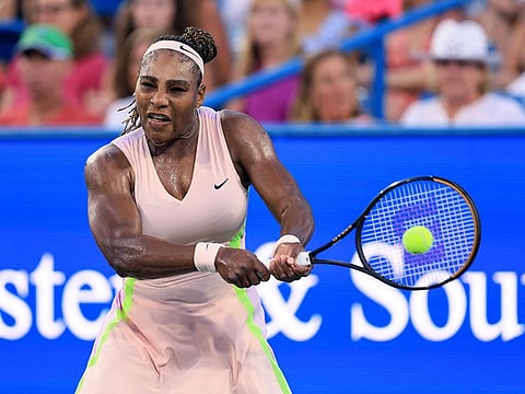 Serena Williams, of the United States, hits a backhand to Emma Raducanu, of Britain, during the Western & Southern Open tennis tournament Tuesday, Aug. 16, 2022, in Mason, Ohio.