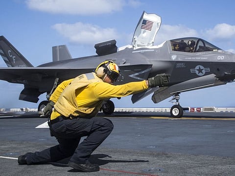 US Navy aviation boatswains mate handler with the Essex Amphibious Ready Group (ARG) launching an F-35B Lightning II from the Wasp-class amphibious assault ship USS Essex (LHD 2) in a file photo.