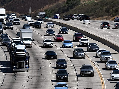 Cars, SUVs, and other vehicles drive in traffic on the 405 freeway through the Sepulveda Pass in Santa Monica, California, on August 25, 2022.