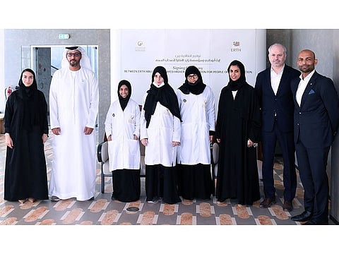 People of determination with representatives from Zayed Higher Organisation and Abu Dhabi Legacy