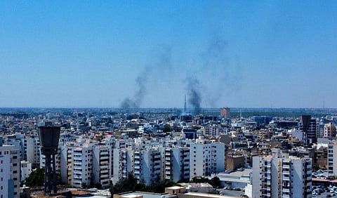 Smoke rises in the sky following clashes in Tripoli, Libya August 27, 2022.
