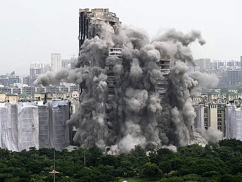 A controlled implosion demolishes the 100-metre-high residential "Twin Towers" on the outskirts of New Delhi, on August 28, 2022.
