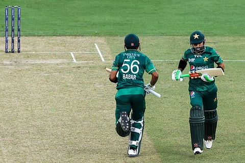 Pakistan's captain Babar Azam (left) and teammate Mohammad Rizwan in action during the Asia Cup Twenty20 international cricket Group A match against India at the Dubai International Cricket Stadium in Dubai.