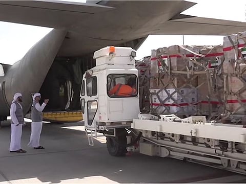 Still from WAM video showing loading of relief supplies on aircraft bound for Pakistan from UAE