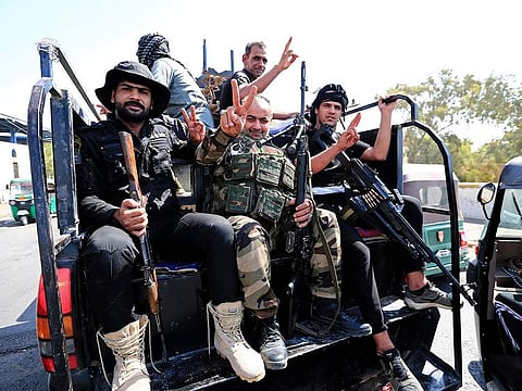 Fighters from the Saraya Salam (Peace Brigades) withdraw from the Green Zone on August 30, 2022 after Sadr gave them an hour deadline to pullout.