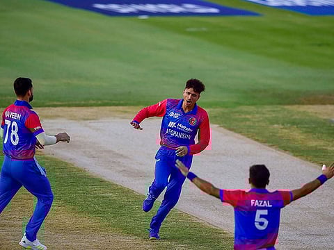 Afghanistan spinner Mujeeb Ur Rahman celebrates after a dismissal against Bangladesh at the Sharjah Cricket Stadium on Tuesday.
