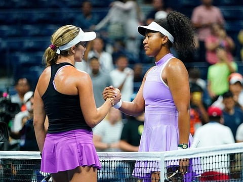 Danielle Collins (left) of the United States, shakes hands with Naomi Osaka, of Japan, during the first round of the US Open tennis championships in New York.