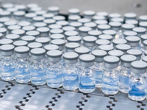 This August 2022 photo provided by Pfizer shows vials of the company's updated COVID-19 vaccine during production in Kalamazoo, Michigan.