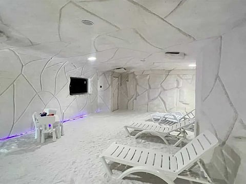 It can accommodate around 35 people and features a play area for children, leather seats, a ventilation system, and walls and floors covered with natural salt