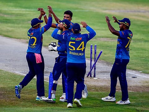 Dilshan Madushanka of Sri Lanka celebrates after taking the wicket of Hazratullah Zazai of Afghanistan during the Super 4 match of the DP World Asia Cup 2022 at the Sharjah Cricket Stadium.