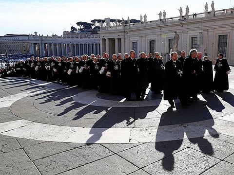 Members of the Order of the Knights of Malta arrive in St. Peter's Basilica for their 900th anniversary in Vatican February 9, 2013.