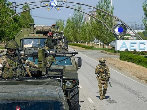 A Russian military convoy is seen on the road toward the Zaporizhzhia Nuclear Power Station, in Enerhodar, Zaporizhzhia region, in territory under Russian military control, southeastern Ukraine, on May 1, 2022.