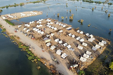 This aerial photograph shows makeshift tents for people displaced due to the floods after heavy monsoon rains at Sohbatpur in Jaffarabad district of Balochistan province on September 4, 2022.