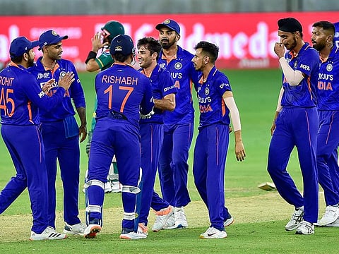 Ravi Bishnoi celebrates with teammates after dismissing Pakistan skipper Babar Azam. The absence of Ravindra Jadeja was felt as the bowlers went for plenty of runs in the middle overs.