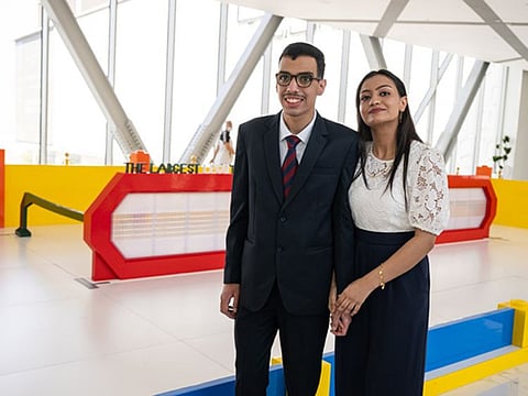 Zeyad Ibrahim, 19, and his sister Salma, 17, from Mansoura, Egypt, in front of the world's largest LEGO brick eyeglasses at The Galleria Al Maryah Island in Abu Dhabi