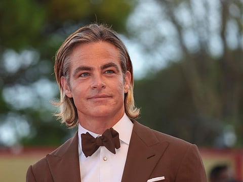 Chris Pine poses for photographers upon arrival at the premiere of the film 'Don't Worry Darling' during the 79th edition of the Venice Film Festival.
