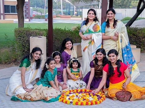 Vineetha Biju (first from right, standing) with her friends and children during an Onam-themed photo shoot in one of the parks in Abu Dhabi.