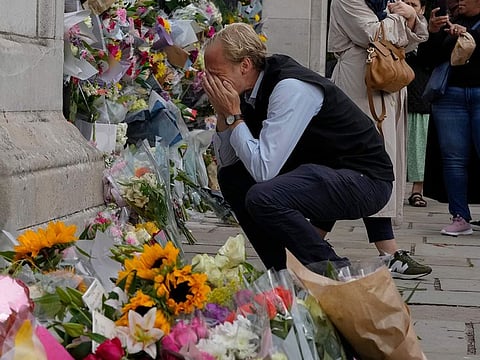 Flowers at the gate of Buckingham Palace in London, Friday, Sept. 9, 2022. Queen Elizabeth II,