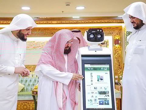 Chief of the General Presidency for Affairs of the Two Holy Mosque Sheikh Abdul Rahman Al Sudais launching the robots..