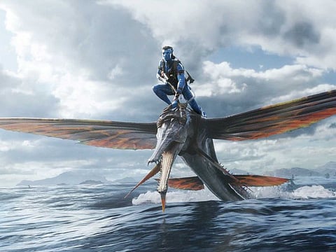 This image released by 20th Century Studios shows Jake Sully, voiced by Sam Worthington, in a scene from "Avatar: The Way of Water."