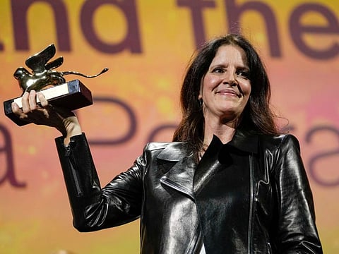 Director Laura Poitras holds the Golden Lion award for best film for 'All the Beauty and the Bloodshed' at the closing ceremony of the 79th edition of the Venice Film Festival in Venice, Italy, Saturday, Sept. 10. 2022.