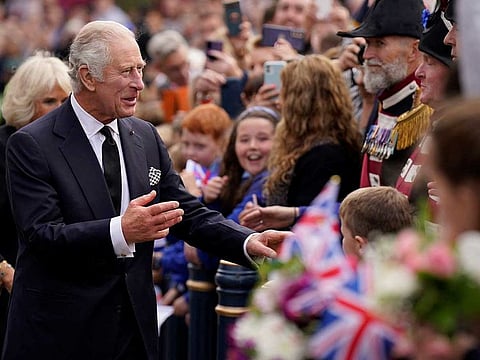 Crowds cheer as King Charles III and the Queen Consort arrive for a visit to Hillsborough Castle on Tuesday, September 13, 2022.
