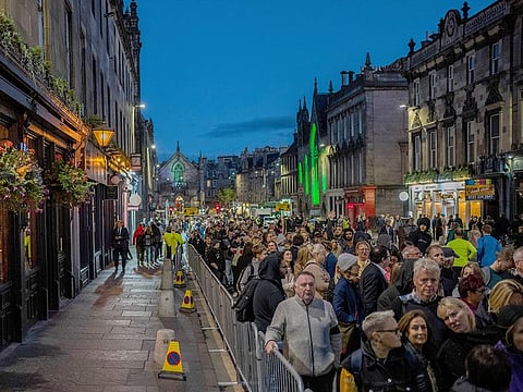 People queue to see the coffin of Queen Elizabeth II as she lies at rest at St Giles Cathedral in Edinburgh, Scotland, on Monday, September 12, 2022.