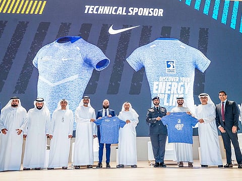 Officials and organisers during the unveiling of the ADNOC Abu Dhabi Marathon T-shirt.