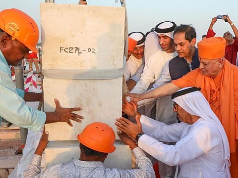 The Indian Embassy in Abu Dhabi on Tuesday shared on social media the images of the ceremony. Dr Thani bin Ahmed Al Zeyoudi, Dr Mugheer Khamis Al Khaili and Dr Tayeb A Kamali interacted with the team building the majestic temple.