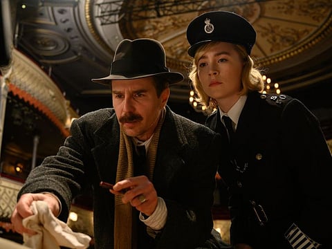 This image released by Searchlight Pictures shows Sam Rockwell and Saoirse Ronan in a scene from "See How They Run."