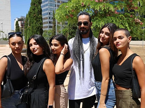 Some members of the Lebanese dance group Mayyas, headed by Choreographer and founder Nadim Cherfan (3rd right), pose for a picture following their meeting with Lebanon's Minister of Culture in Beirut in this photo taken on June 29, 2022.