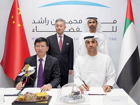 L-R: CNSA vice administrator Wu Yanhua and MBRSC director general Salem Humaid AlMarri; standing - Chinese ambassador Zhang Yiming and MBRSC vice chairman Yousuf Hamad AlShaibani
