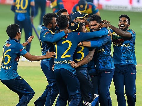 Sri Lankan team celebrate after their win over Pakistan in the Asia Cup final at Dubai International Cricket Stadium.