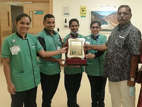 Sanil Kumar presents memento to nurses who cared for him at Aster Hospital, Al Qusais