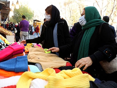 Women shop at a street in Tehran in a file photo. In the past few months, Iranian rights activists have urged women to publicly remove their veils, a gesture that would risk their arrest for defying the Islamic dress code as the country’s hardline rulers crack down harder on “immoral behaviour”.