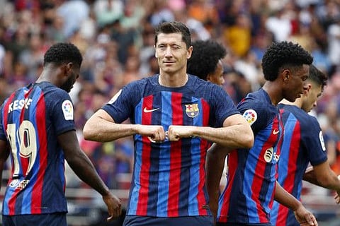Barcelona's Robert Lewandowski celebrates after scoring the opening goal during the Spanish La Liga match against Elche CF at Camp Nou stadium in Barcelona, Spain.