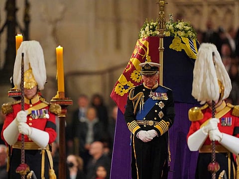 Britain's King Charles III holds a vigil beside the coffin of Queen Elizabeth II as it lies in state on the catafalque in Westminster Hall, at the Palace of Westminster, London, Friday Sept. 16, 2022.