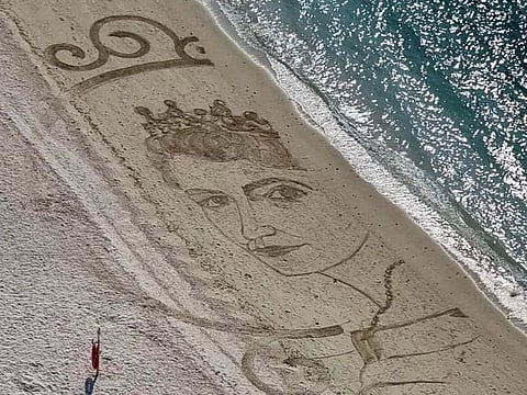 Nathaniel Alapide created a 15metre X 8metre portrait of a young Queen Elizabeth II on the shores of Ras Al Khaimah over the weekend