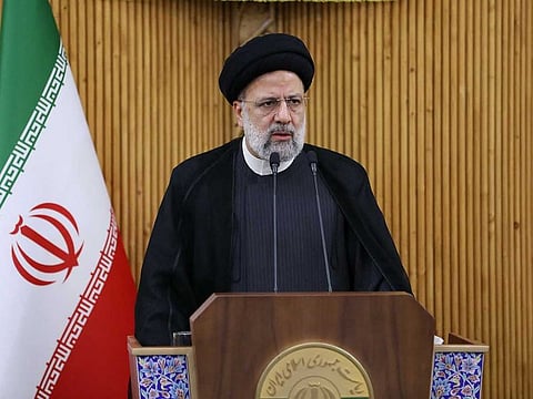 This handout picture provided by the Iranian Presidency shows Iran's President Ebrahim Raisi addressing the media before he departs from the capital Tehran's Mehrabad International Airport on September 19, 2022 to attend the 77th session of the UN General Assembly (UNGA 77) in New York.