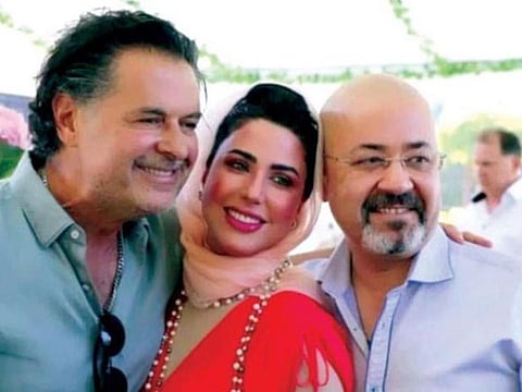 Lebanese singer Ragheb Alama (left) in a file photo with with Iraqi ambassador to Jordan Haider Al Adhari and his wife Maysam Al Rubaie.  The envoy was recalled following the controversial photos with the pop star in 2022.