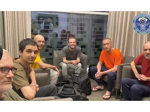 Prisoners of war (POWs) sit after a swap, amid Russia's attack on Ukraine, in a location given as Riyadh, Saudi Arabia, in this screen grab taken from a handout video September 21, 2022. Coordination Headquarters for Treatment of Prisoners of War/Handout via REUTERS