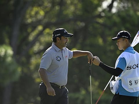 Dubai-based Shiv Kapur with caddy in Taipei on the Asian Tour.