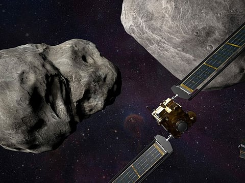 This illustration made available by Johns Hopkins APL and NASA depicts NASA's DART probe, foreground right, and Italian Space Agency's (ASI) LICIACube, bottom right, at the Didymos system before impact with the asteroid Dimorphos, left. DART is expected to zero in on the asteroid Monday, Sept. 26, 2022, intent on slamming it head-on at 22,500 kmph. The impact should be just enough to nudge the asteroid into a slightly tighter orbit around its companion space rock.