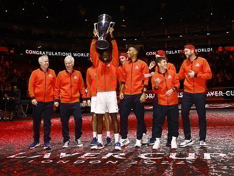 Team World's Frances Tiafoe celebrates with the trophy after winning the Laver Cup.