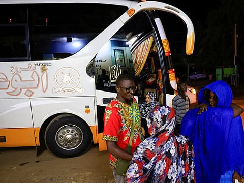 Family gathers for a farewell before departure by bus to Egypt in Khartoum, Sudan September 24, 2022.