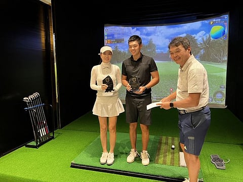Sonya and William Xu, winners of the recent golf tournament at MyGolf Dubai, with Stephen Hong, MyGolf Academy Director.