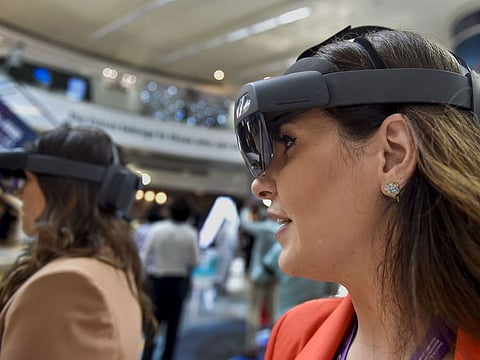 Metaverse is an online, 3D, virtual universe connecting users in all aspects of their lives. Like the internet, it connects multiple platforms through a single browser. The metaverse is not yet fully in existence but it is dubbed as the future iteration of the internet that will allow users to work, meet, game, and socialise in these 3D virtual spaces. Above, exhibitors at Microsoft stand at the Dubai Metaverse Assembly at Emirates Towers in Dubai.