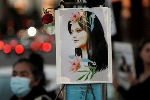 An image of Mahsa Amini, an Iranian Kurdish woman, is displayed on a pole during a protest following her death, in Los Angeles, California.