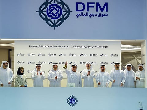 Mattar Al Tayer, director-general and chairman of the Board of Executive Directors of the RTA ring the bell to celebrate the listing of Salik at Dubai Financial Market.